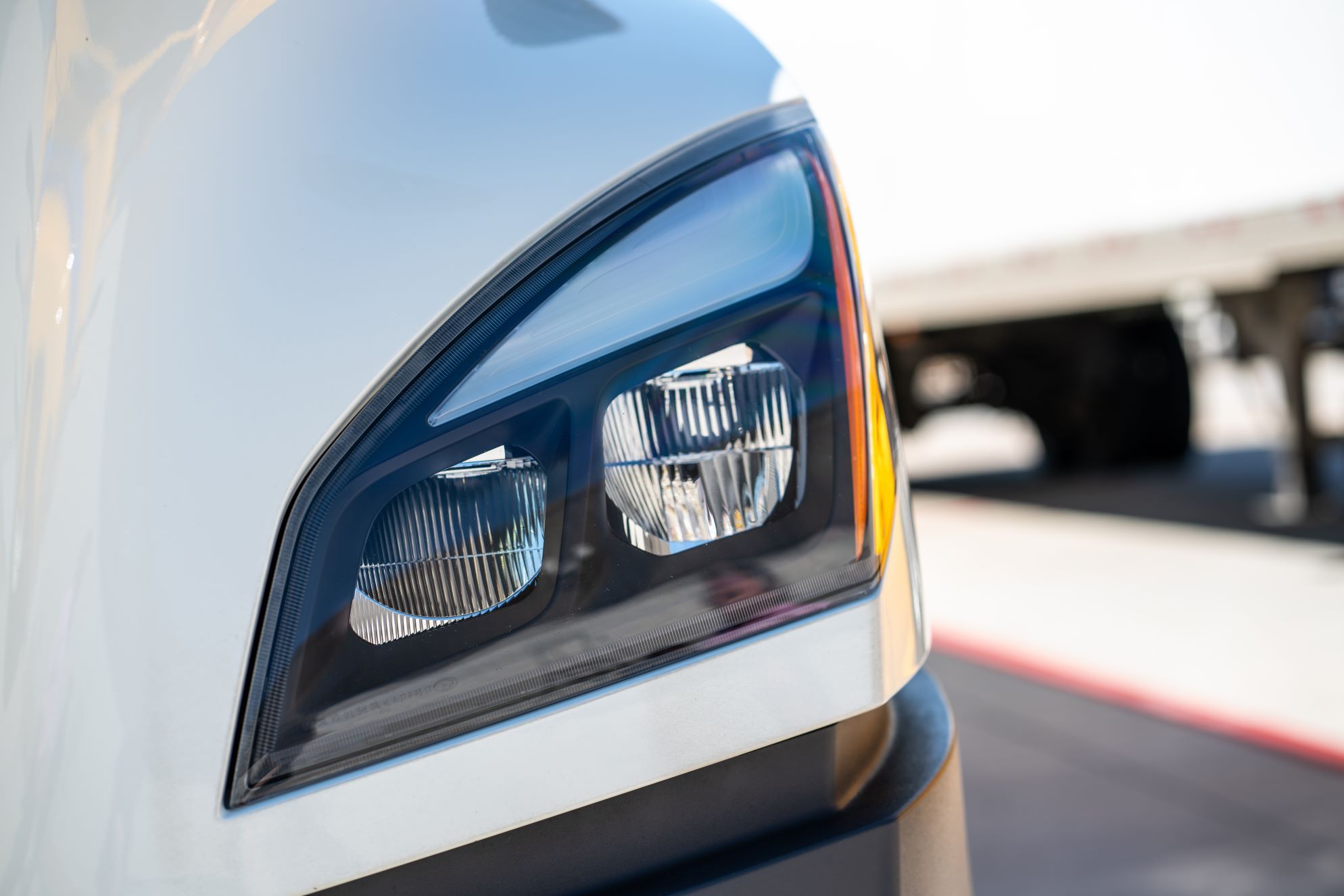 A close-up shot of a truck headlight